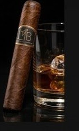 LTB Tobacco Brands cigar resting against a whiskey glass